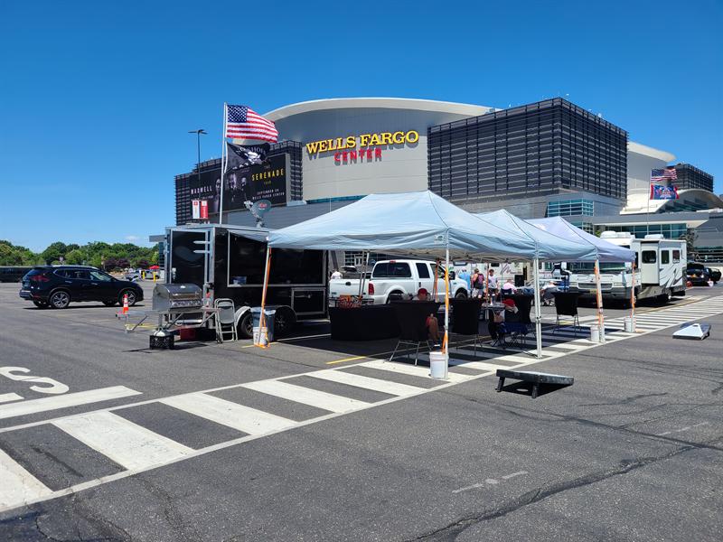 Kenny Chesney concert tailgate outside the Wells Fargo Center, with a Kenny Chesney No Shoes Nation flag flying over the trailer